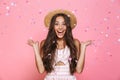 Photo of stylish woman 20s wearing straw hat laughing while stan