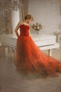 Photo stylized as old picture. Woman and piano.