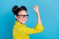 Photo of successful chief manager girl career development raise biceps up overcome hurdle isolated blue color background