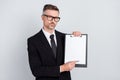 Photo of successful smart leader banker guy hold clip board point pen paper signing partners isolated over grey color Royalty Free Stock Photo