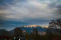 Photo about sun beam falling on mountains covered with snow. Beautiful view of hills. Royalty Free Stock Photo
