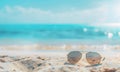 Sun glasses on the beach with turquoise sea background