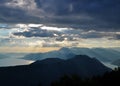 The sun shining through the clouds in the late afternoon Royalty Free Stock Photo