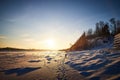 Photo of a sunset at winter snowy field, peaceful stunning landscape, amazing seasonal nature, cold weather in the park