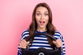 Photo of surprised funny young girl brown curls drive her new fast car unexpected how cool this purchase isolated on Royalty Free Stock Photo