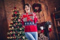 Photo surprised omg reaction young woman brown bob hair wear red warm sweater holding package santa claus miracle