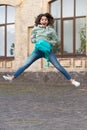 photo of surprised school girl jump childhood with backpack. school girl childhood jump