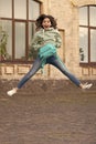 photo of surprised school girl jump childhood with backpack. school girl childhood jump