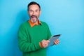 Photo of surprised shock business man wear green jumper hold tablet notepad shocked black friday cheap proposition