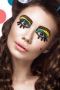 Photo of surprised young woman with professional comic pop art make-up and design manicure. Creative beauty style.