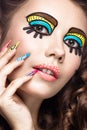 Photo of surprised young woman with professional comic pop art make-up and design manicure. Creative beauty style. Royalty Free Stock Photo