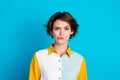 Photo of suspicious uncertain woman wear shirt rising brow looking you isolated blue color background Royalty Free Stock Photo