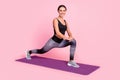 Photo of sweet adorable young woman dressed sportive outfit smiling practicing yoga stretching isolated pink color