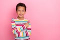 Photo of sweet charming positive boy wear striped long sleeve impressed indicated at empty space isolated on pink color