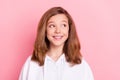 Photo of sweet charming small schoolgirl dressed white sweatshirt smiling looking empty space pink color