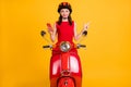 Photo of sweet lady wear red dress headwear sitting retro bike holding gadget pointing empty space isolated yellow color Royalty Free Stock Photo