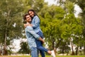 Photo of sweet pair spending best leisure time in green park wear casual denim outfit