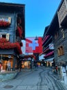 Photo of Switzerland flag in the Zermatt streets