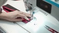 Photo of tailor sewing order on electric machine