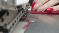 Photo of tailor sewing order on electric overlock