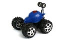 A blue remote controlled monster truck toy car against a white backdrop