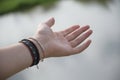 A female caucasian fair skinned left arm hand reaching out with opened palm