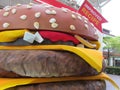 A giant sized model display of a McDonalds Double Quarter Pounder hamburger with cheese