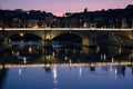 Sunset on an ancient bridge of Rome, Italy Royalty Free Stock Photo