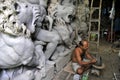 A busy clay idol maker at kumartuli kolkata