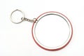 A large round keychain with mirror at the back face
