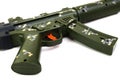 An olive military green toy submachine gun with camouflage paint