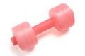 A single pink red plastic water refillable dumbbell