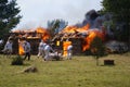 Grunwald, Poland - 2009-07-18: Burning huts Royalty Free Stock Photo