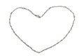 A silver necklace with intertwine twisted metal design laid out in the shape of a heart