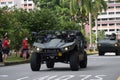 A Singapore military light strike vehicle driving past the heartlands at Jurong West Avenue 5 during the nation`s 55th National Da