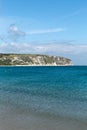 A photo taken on a spring day at Swanage beach looking towards the boats on the sea