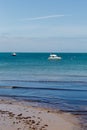 A photo taken on a spring day at Swanage beach looking towards the boats on the sea