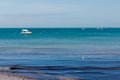 A photo taken on a spring day at Swanage beach looking towards the boats on the sea