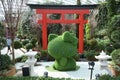 A topiary of Hello Kitty backed by a Japanese red Torii Gate at Singapore Gardens by the Bay Flower Dome in year 2021