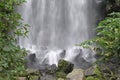 A waterfall with smooth silky falling water in a dense forest