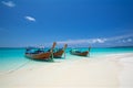 Thai fishing boats on the azure sea on the bounty beach in thailand Royalty Free Stock Photo