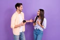 Photo of talking conversation dialogue two young people friends hold new cafeteria liquid drink fresh coffee isolated on Royalty Free Stock Photo