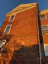 Tall Red Brick Condominium Building at Sunset