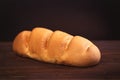 Photo of tasty fresh bread loaf on the wonderful brown wooden ba Royalty Free Stock Photo