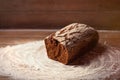 Photo of tasty fresh loaf of bread on the wonderful brown wooden Royalty Free Stock Photo