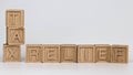 Photo on tax relief theme. wooden cubes with the words