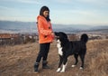 Girl and dog walk on the mountain Royalty Free Stock Photo