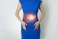 Photo template of unrecognizable woman representing graphic visualisation of pancreas organ highlighted red.