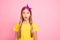 Photo of terrified girl seeing something negatively special while with pink background