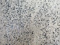 Textured photograph, concrete wall with cracks, black dots from wood, marble, background, for design.